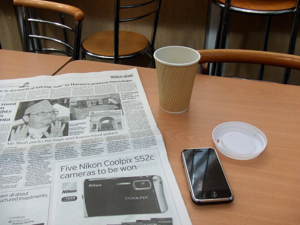 Newwspaper, coffee and iPhone