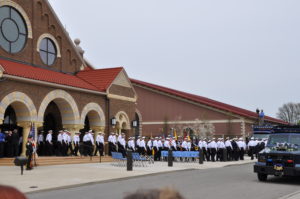 Officers exit the church